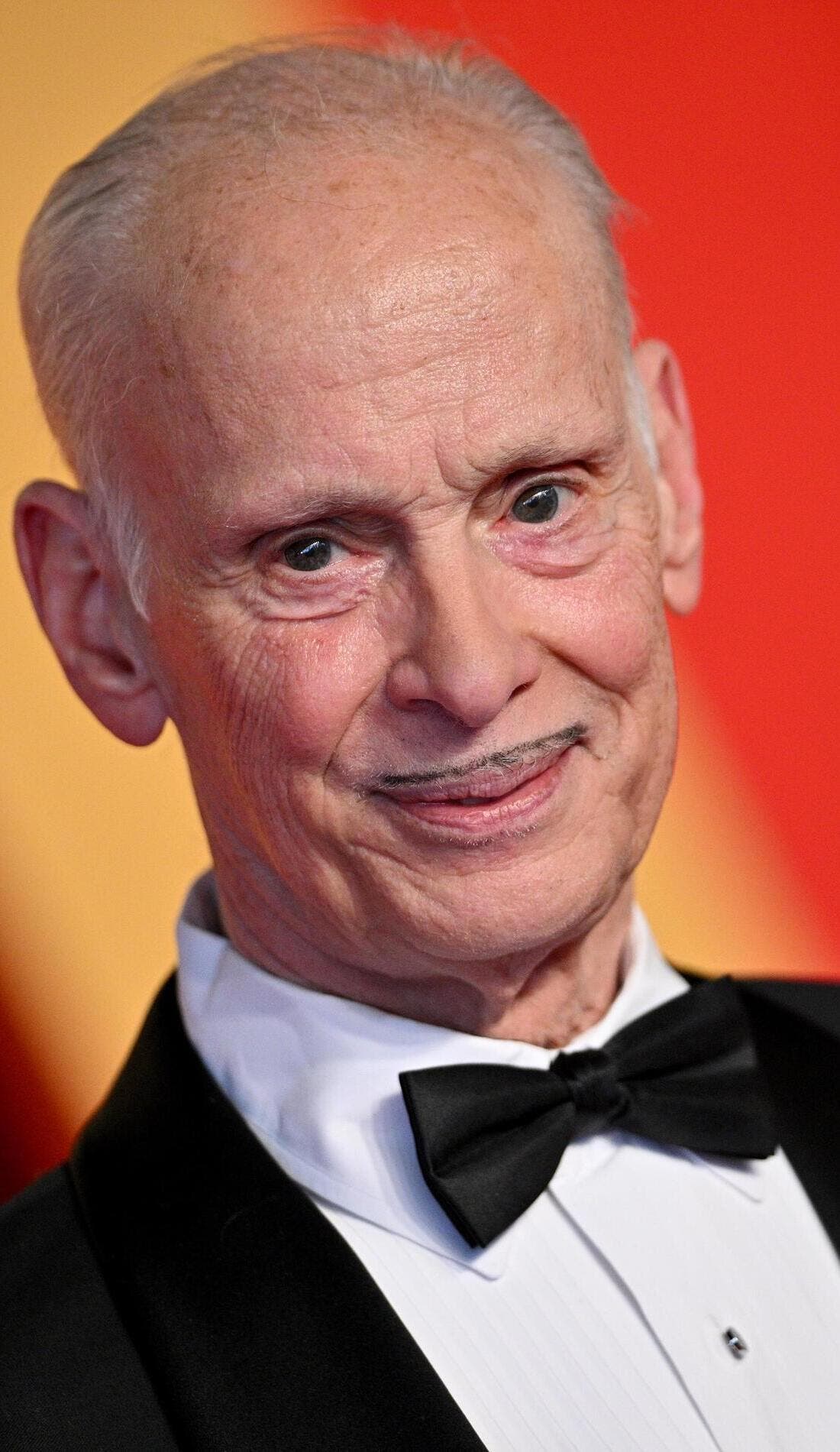 A John Waters Christmas promotional image for upcoming events and ticket sales in Palm Springs