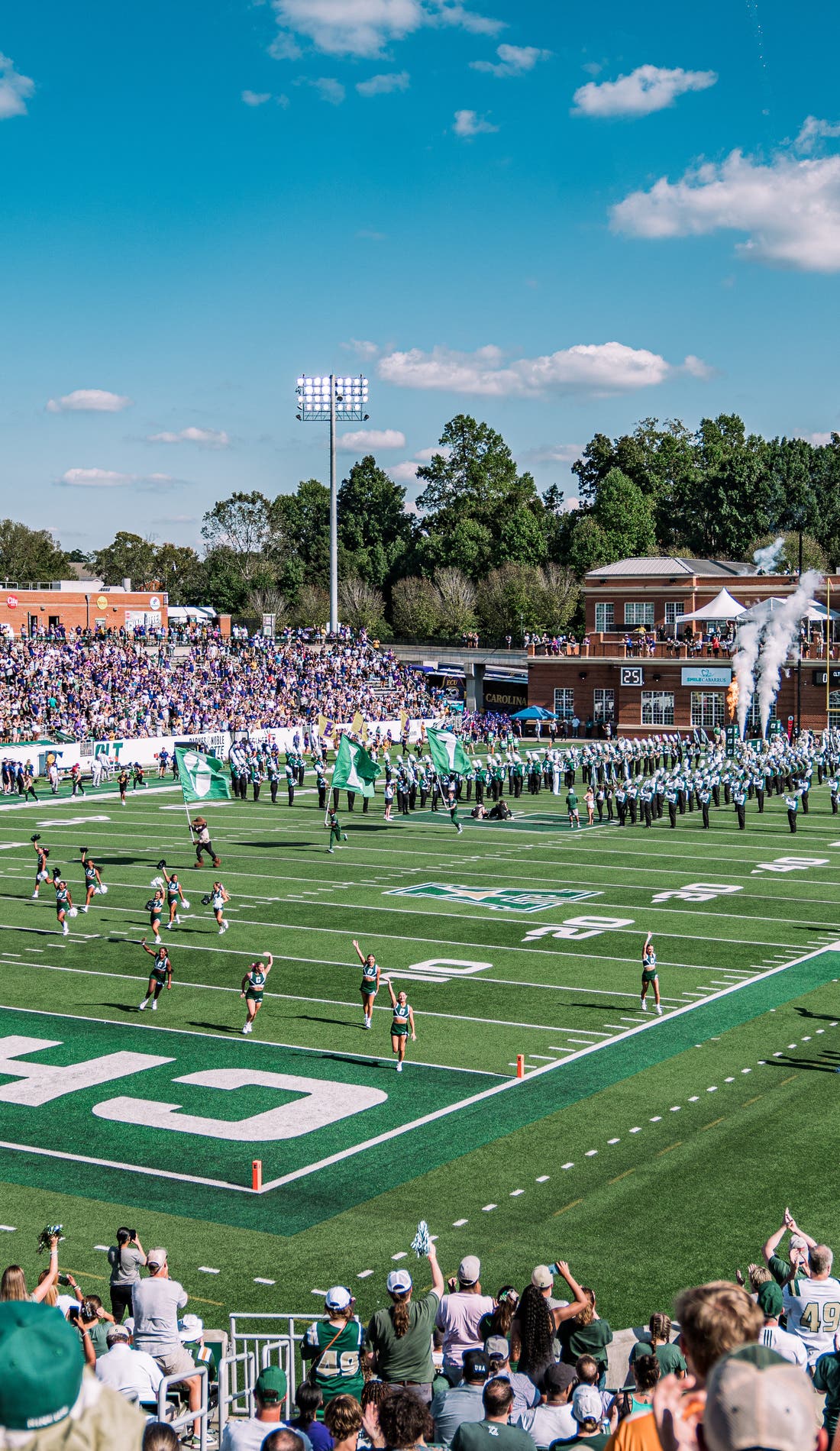 View from a seat at a Charlotte 49ers Football vs Wesley College Wolverines Football game, showing the teams playing