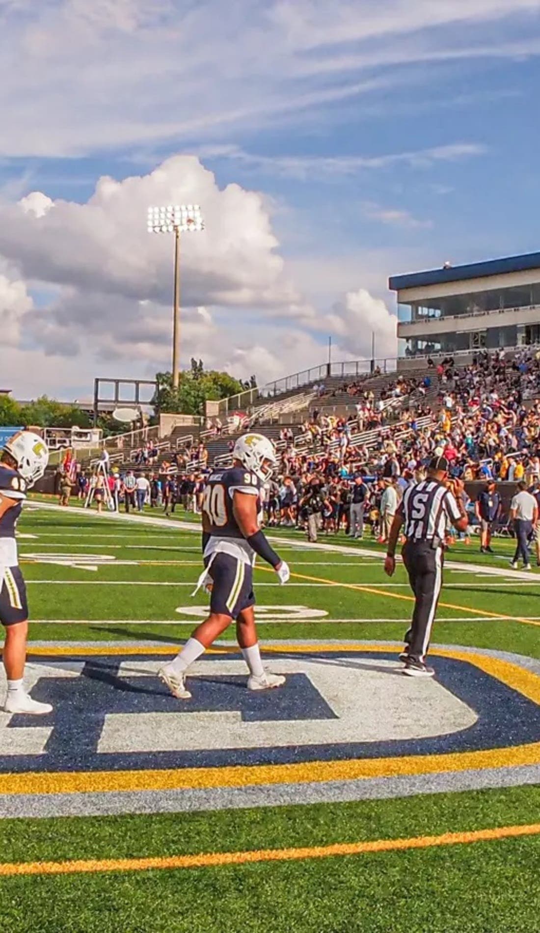 View from a seat at a Chattanooga Mocs Football vs Mercer Bears Football game, showing the teams playing