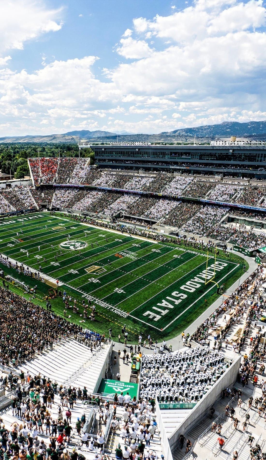 View from a seat at a Colorado State Rams Football vs South Dakota State Jackrabbits Football game, showing the teams playing