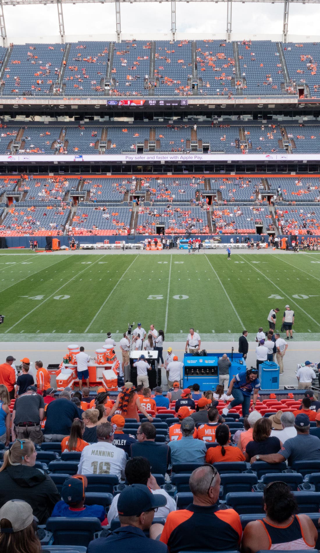 View from a seat at a Denver Broncos vs New England Patriots game, showing the teams playing