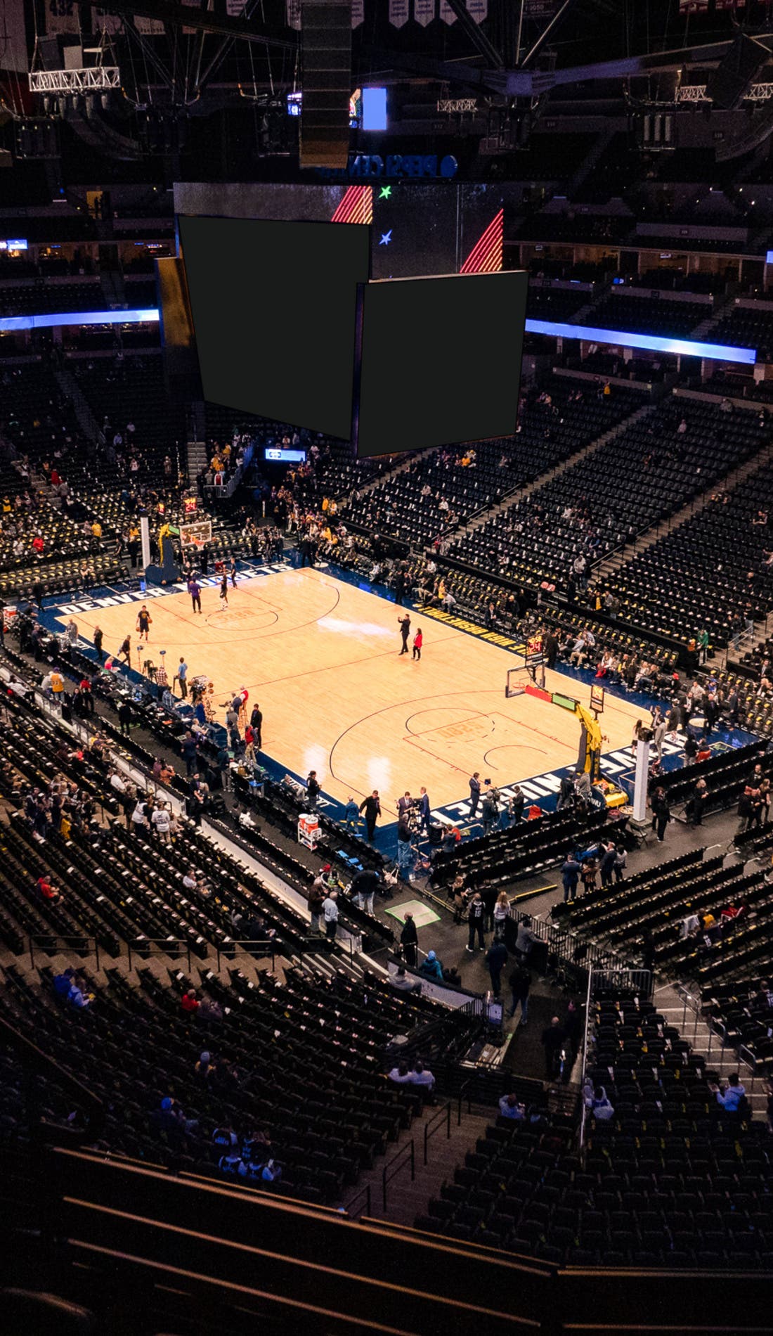 View from a seat at a Denver Nuggets vs Houston Rockets game, showing the teams playing