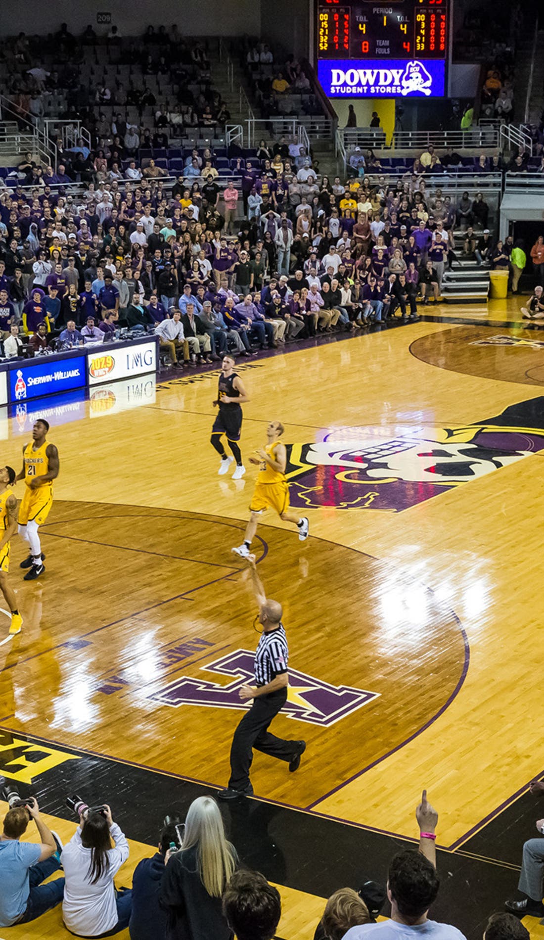 View from a seat at a East Carolina Pirates Mens Basketball vs Coastal Carolina Chanticleers Mens Basketball game, showing the teams playing