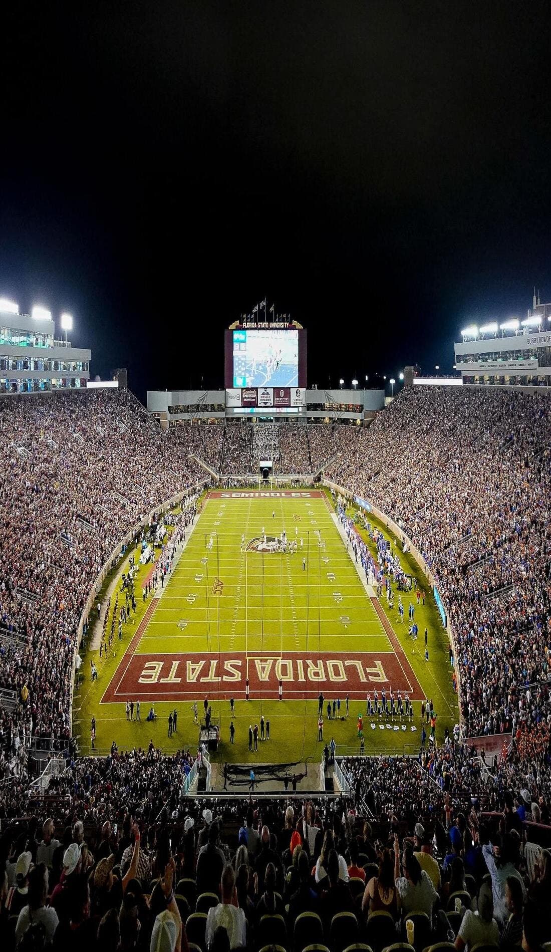 View from a seat at a Florida State Seminoles Football vs Oklahoma Sooners Football game, showing the teams playing