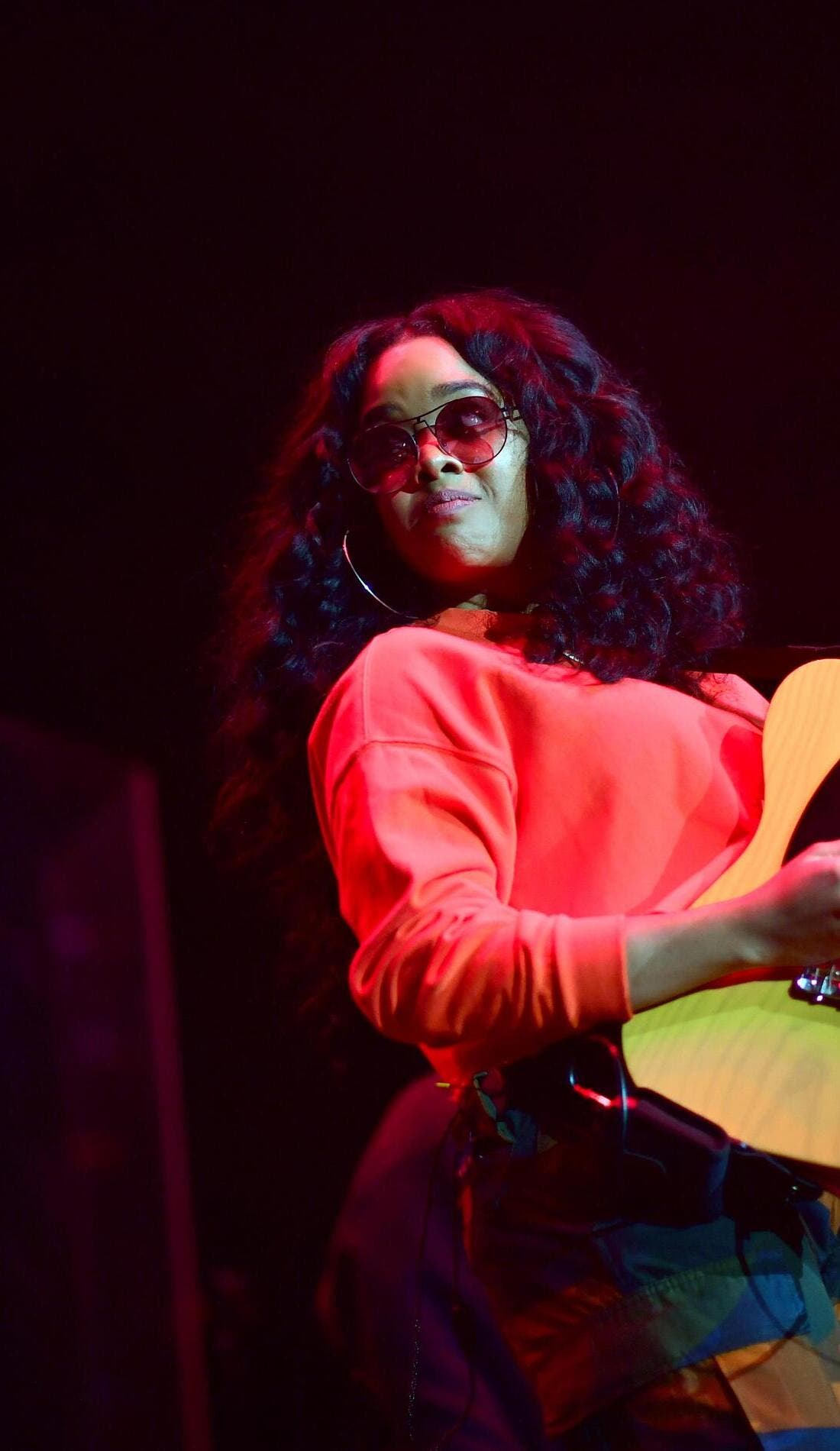 H.E.R. promotional image for upcoming events and ticket sales