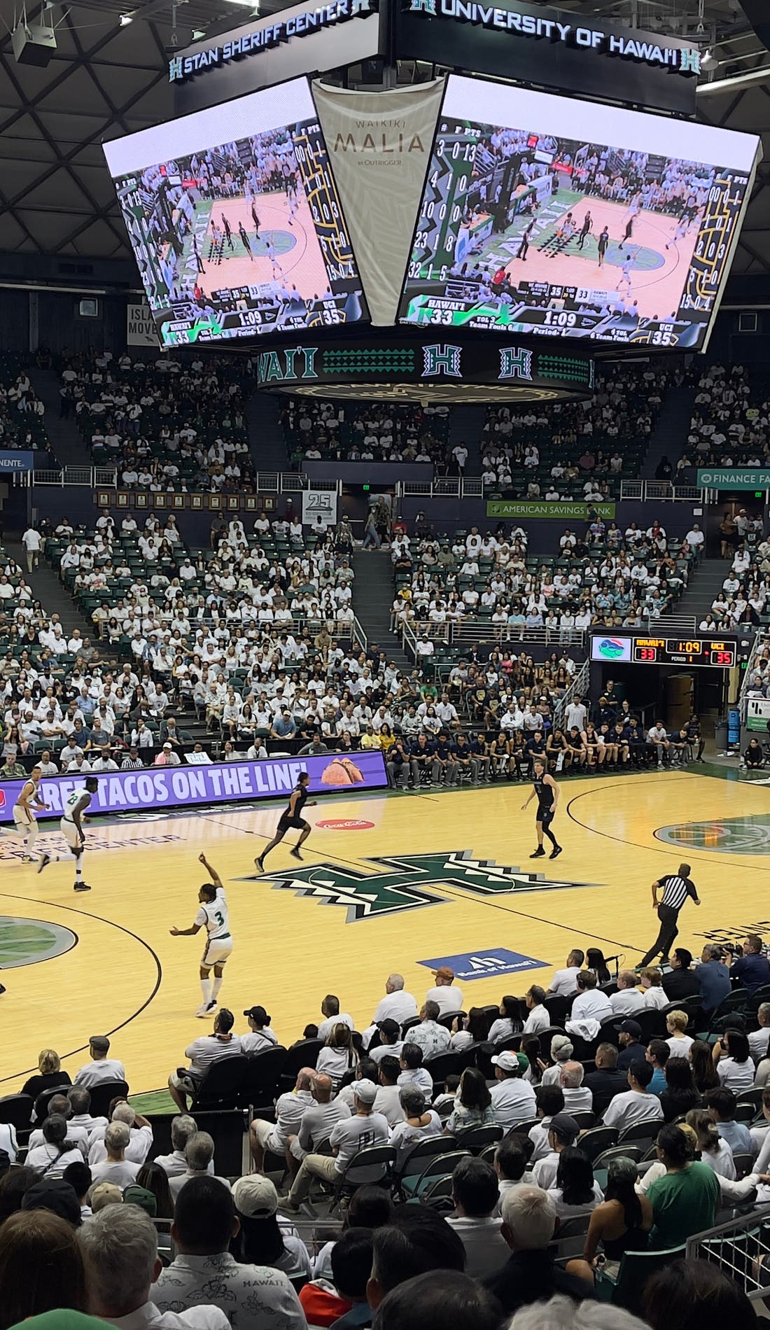 View from a seat at a Hawaii Rainbow Warriors Mens Basketball vs Adams State Grizzlies Mens Basketball game, showing the teams playing