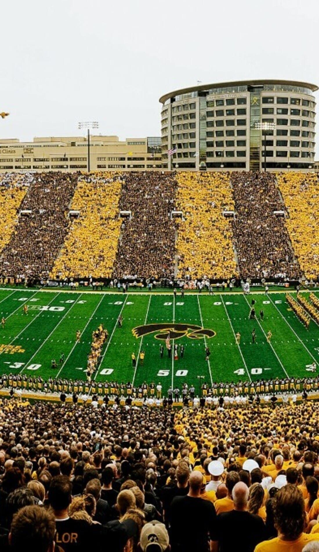 View from a seat at a Iowa Hawkeyes Football vs Michigan Wolverines Football game, showing the teams playing