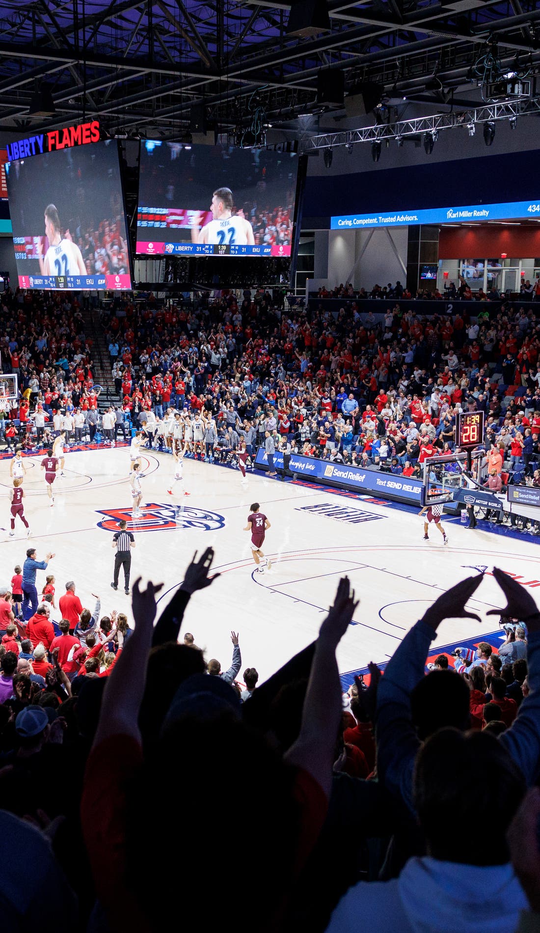 View from a seat at a Liberty Flames Mens Basketball vs Akron Zips Mens Basketball game, showing the teams playing