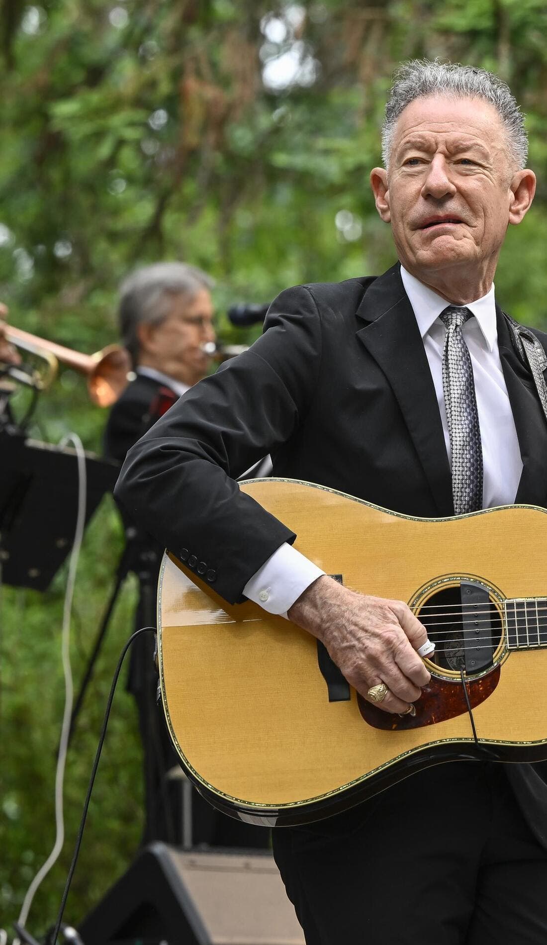 Lyle Lovett and his Small Large Band promotional image for upcoming events and ticket sales