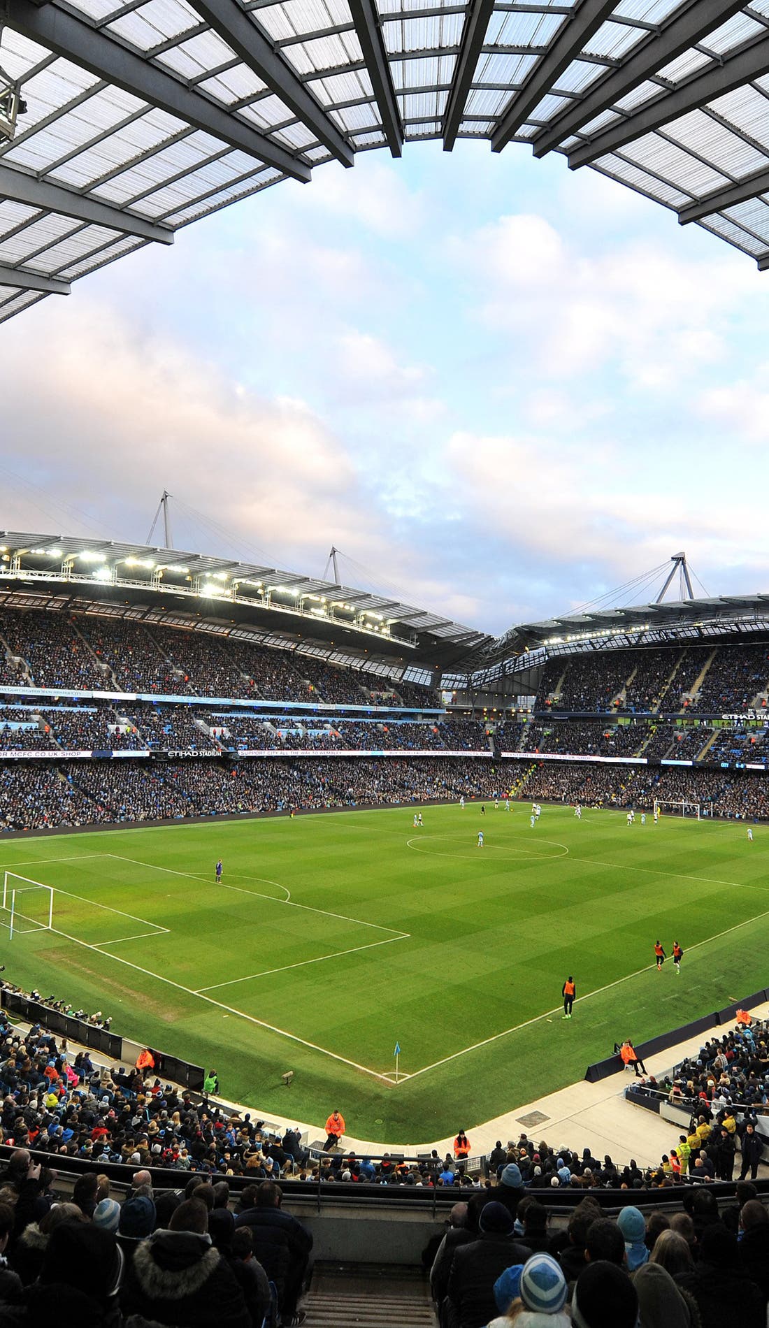 Vue d'un siège à un match Manchester City contre AS Roma, montrant les équipes en action