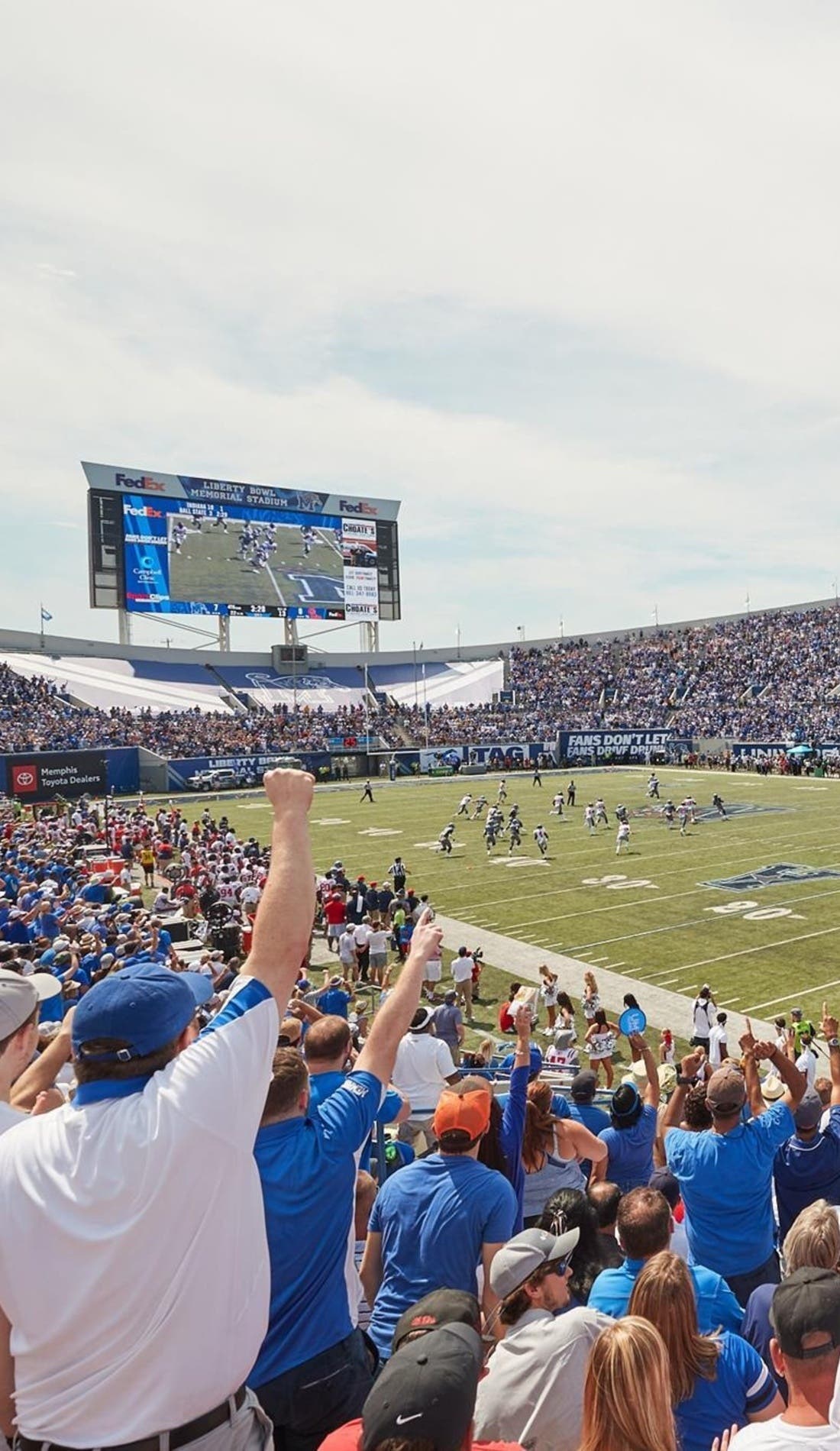View from a seat at a Memphis Tigers Football vs SMU Mustangs Football game, showing the teams playing