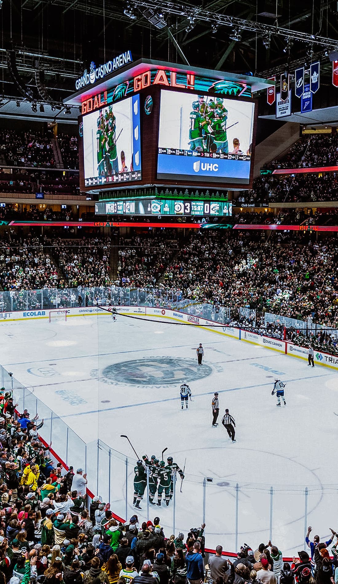 View from a seat at a Minnesota Wild vs San Jose Sharks game, showing the teams playing