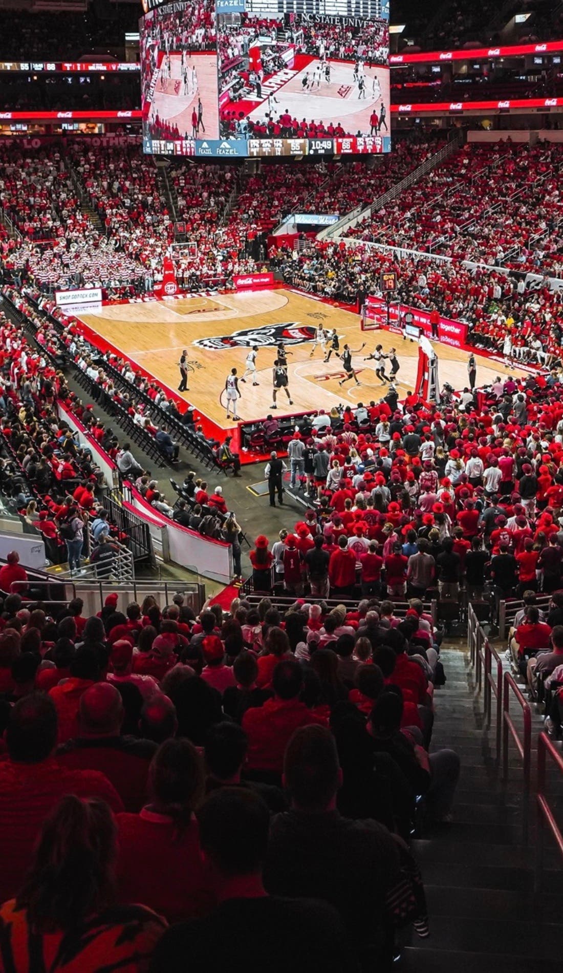 View from a seat at a NC State Wolfpack Mens Basketball vs Wisconsin Badgers Mens Basketball game, showing the teams playing