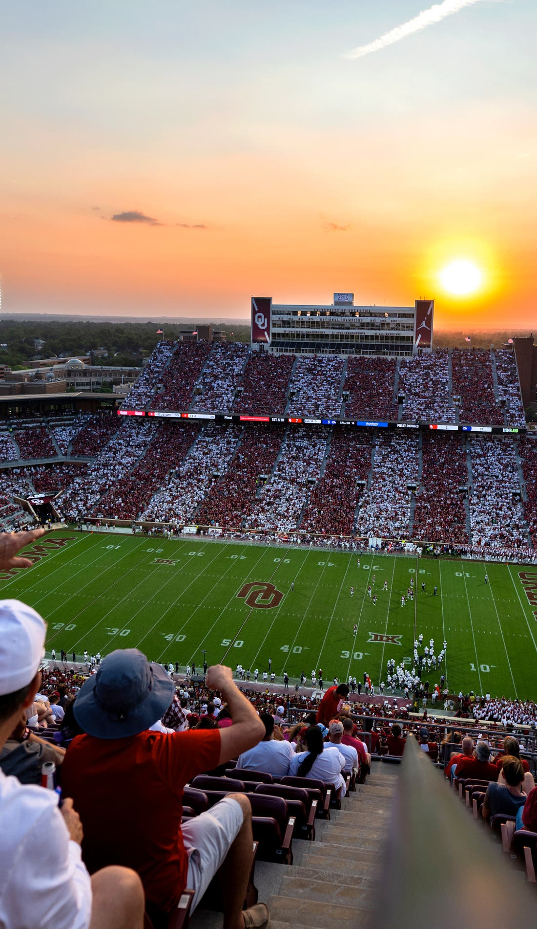 View from a seat at a Oklahoma Sooners Football vs Tulane Green Wave Football game, showing the teams playing