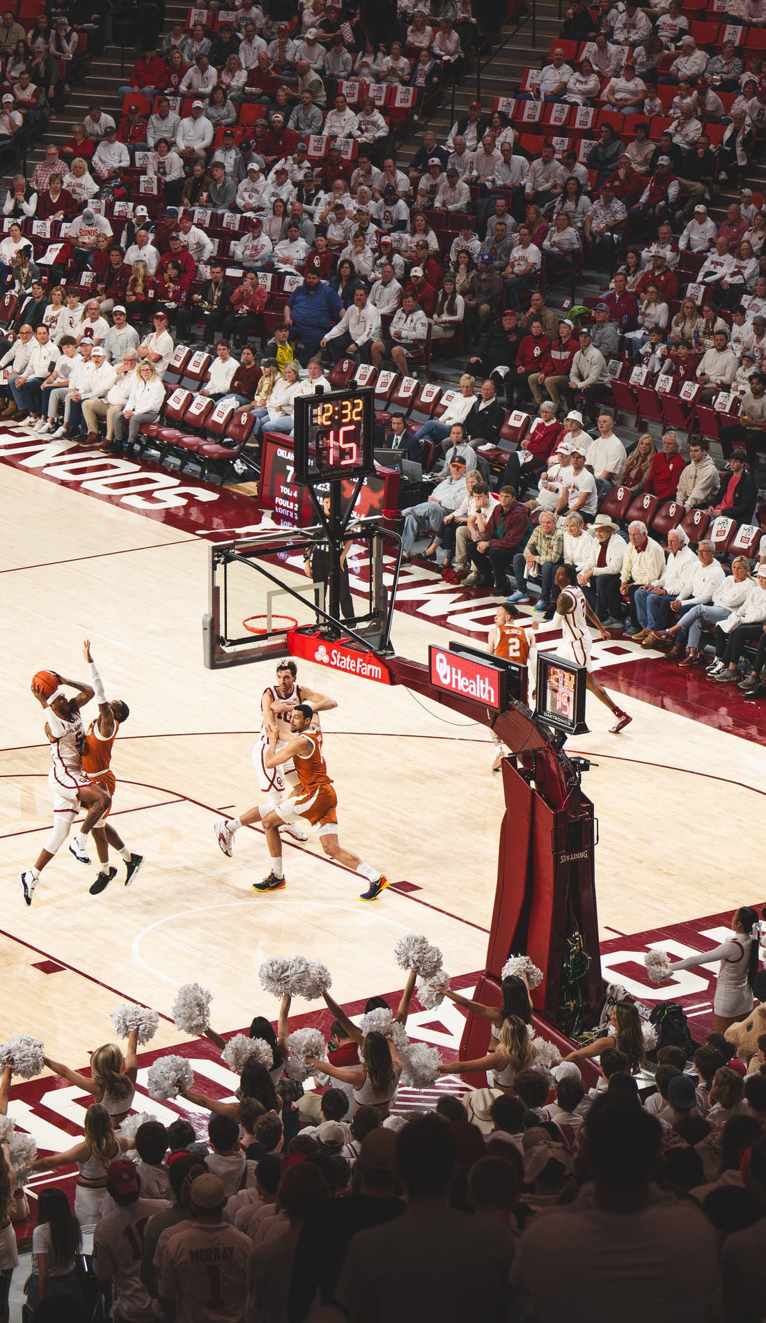 View from a seat at a Oklahoma Sooners Mens Basketball vs USC Trojans Mens Basketball game, showing the teams playing