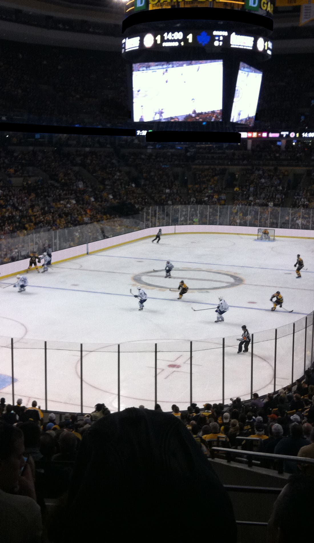 View from a seat at a Parking: Boston Bruins vs Minnesota Wild game, showing the teams playing