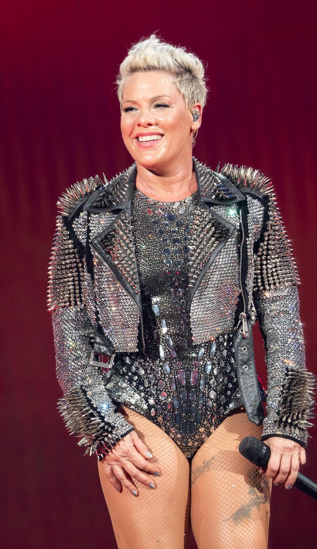 Pink promotional image for upcoming events and ticket sales