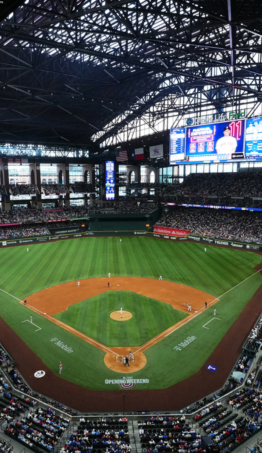View from a seat at a Texas Rangers vs San Francisco Giants game, showing the teams playing