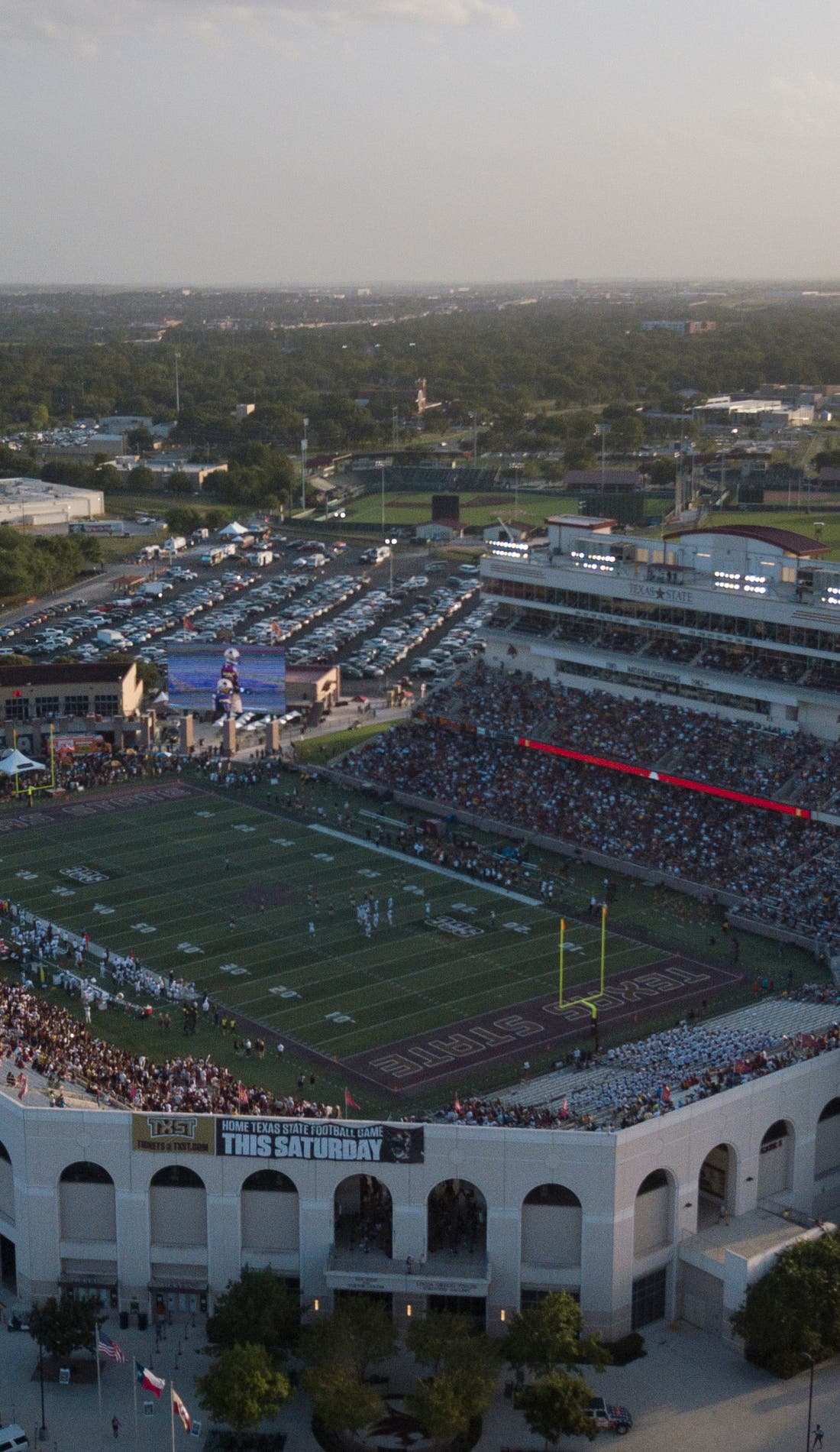 View from a seat at a Texas State Bobcats Football vs Coastal Carolina Chanticleers Football game, showing the teams playing