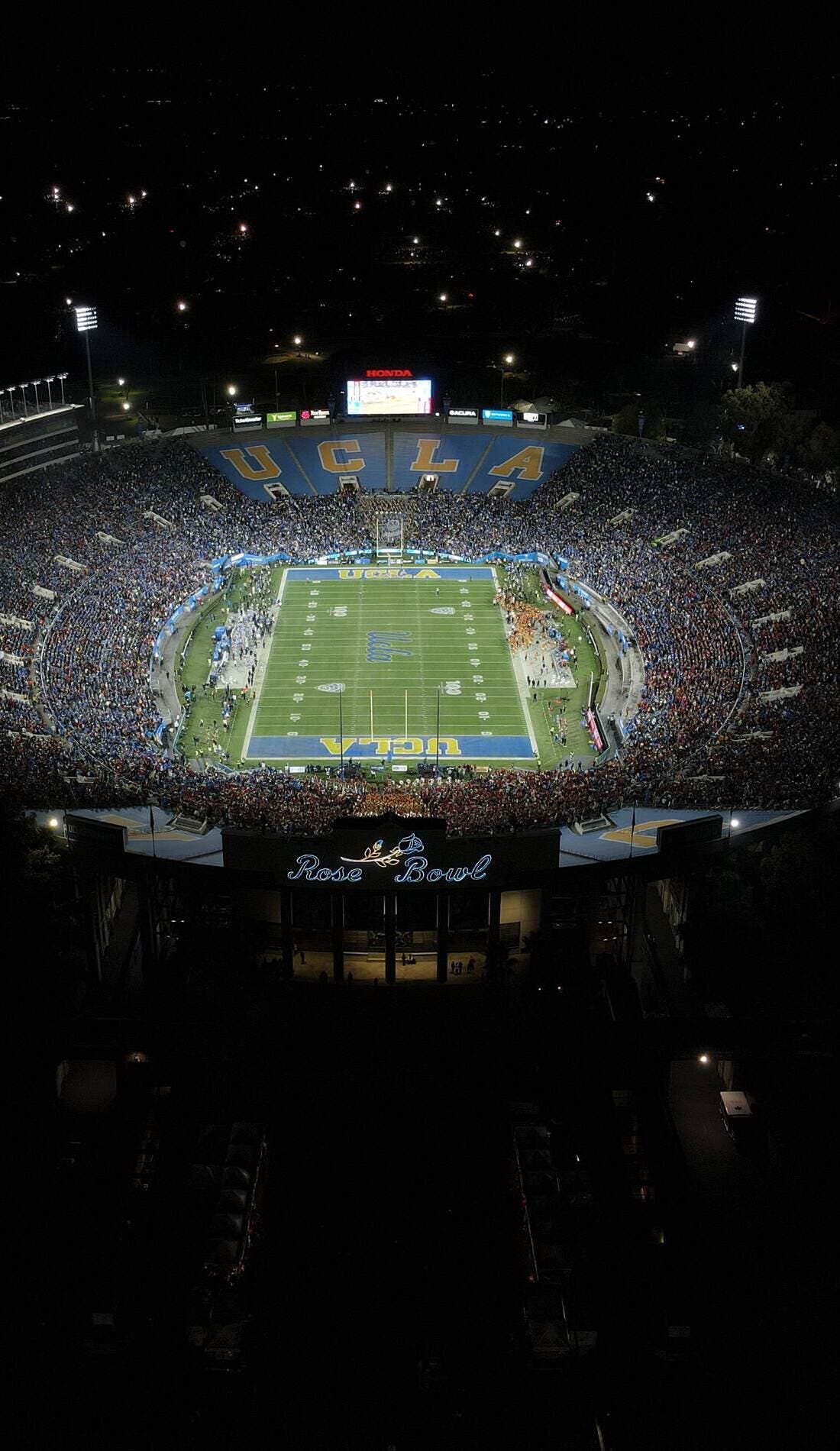 View from a seat at a UCLA Bruins Football vs Washington State Cougars Football game, showing the teams playing