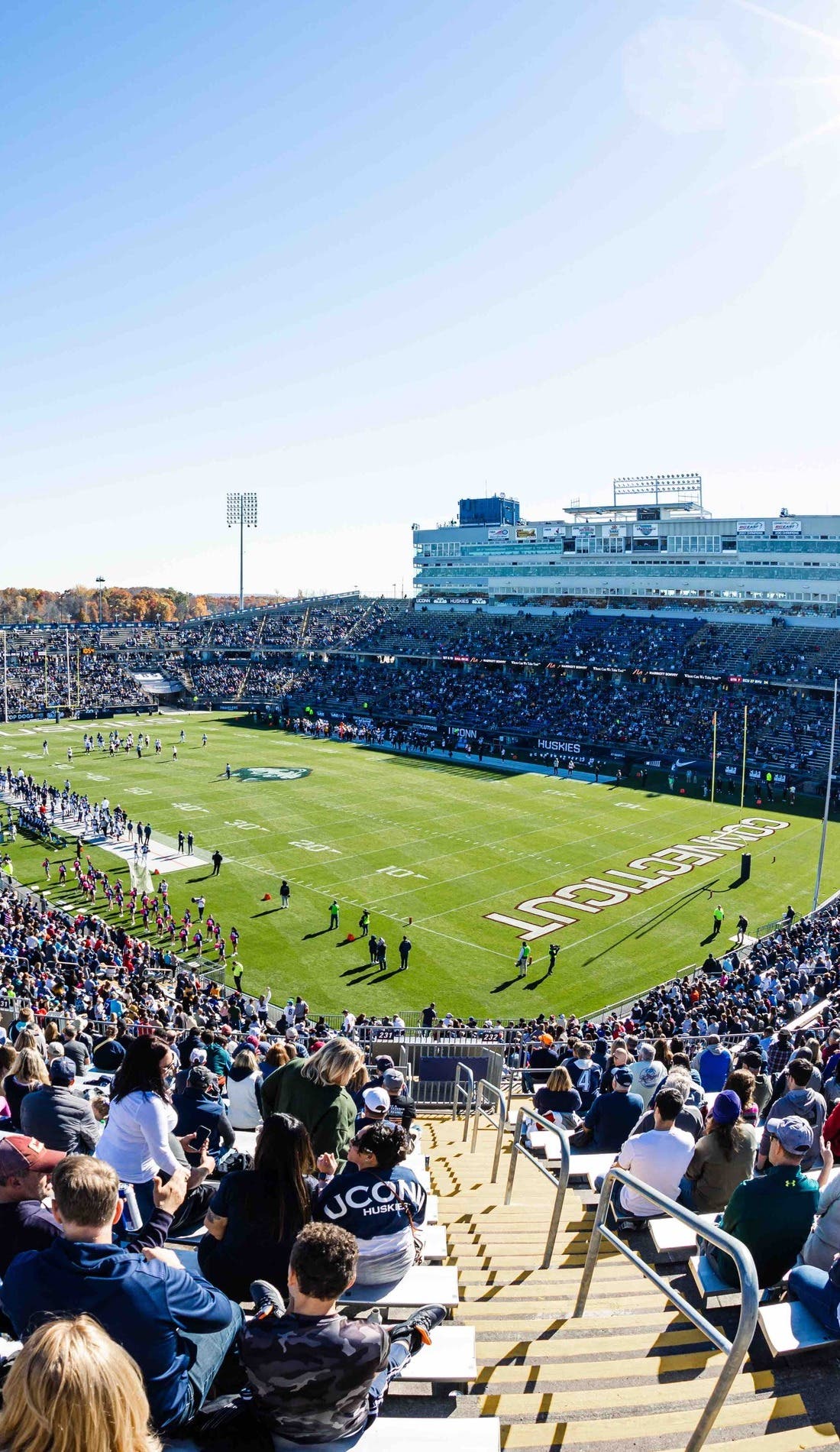 View from a seat at a UConn Huskies Football vs Holy Cross Crusaders Football game, showing the teams playing