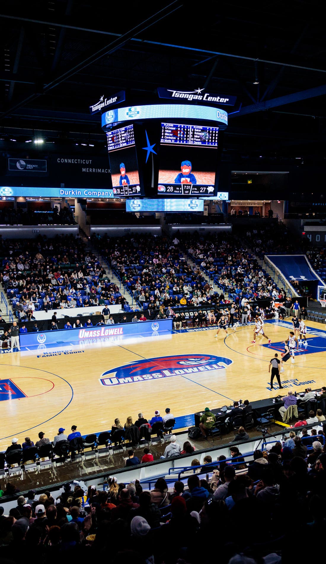 View from a seat at a UMass Lowell River Hawks Mens Basketball vs Merrimack Warriors Mens Basketball game, showing the teams playing