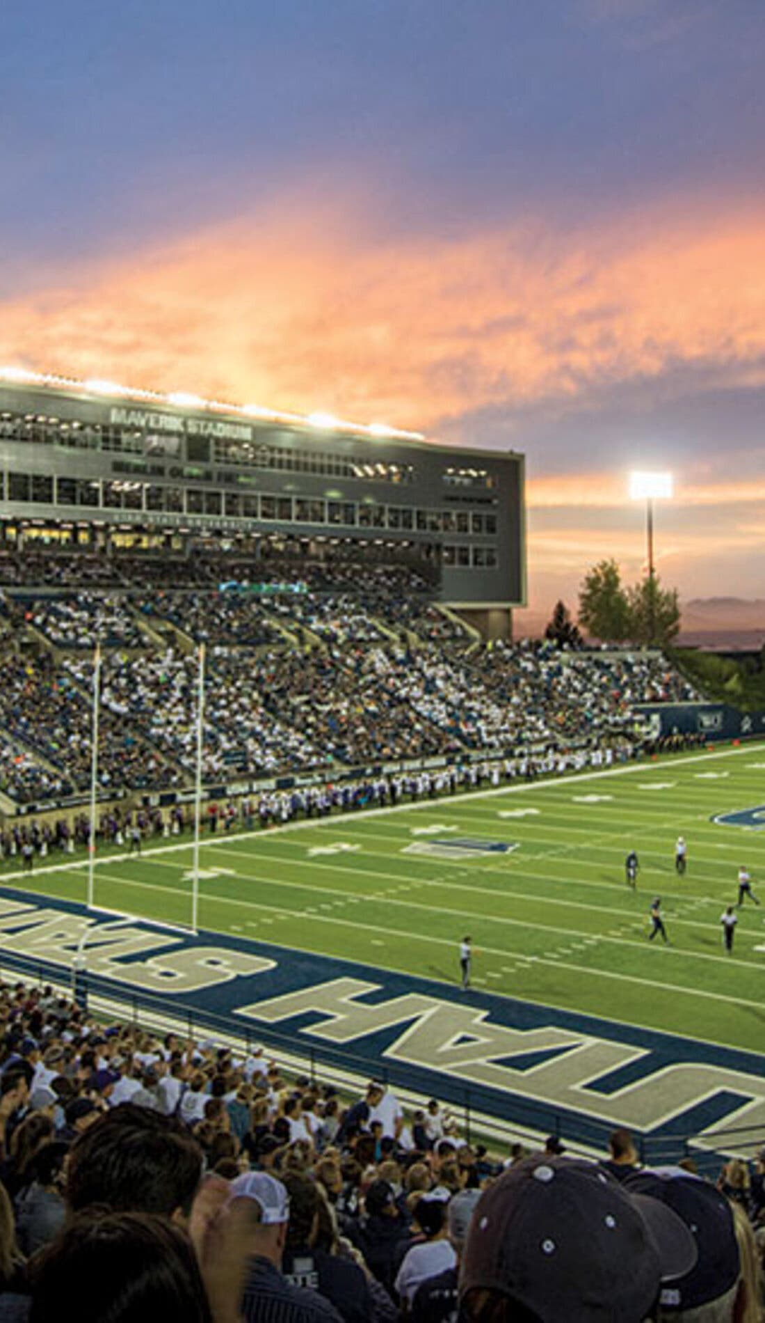 View from a seat at a Utah State Aggies Football vs Robert Morris Colonials Football game, showing the teams playing