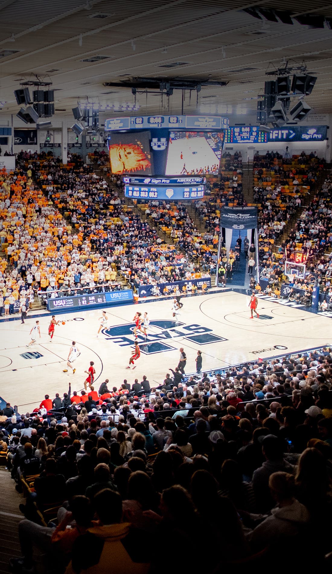 View from a seat at a Utah State Aggies Mens Basketball vs Alabama State Hornets Mens Basketball game, showing the teams playing