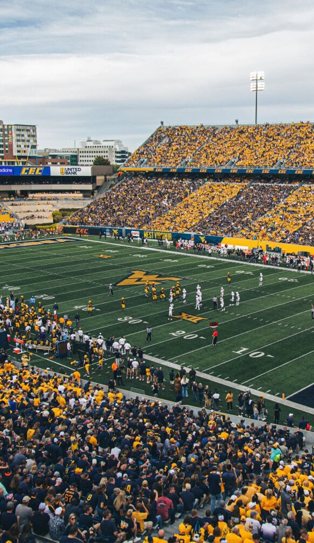 View from a seat at a West Virginia Mountaineers Football vs James Madison Dukes Football game, showing the teams playing