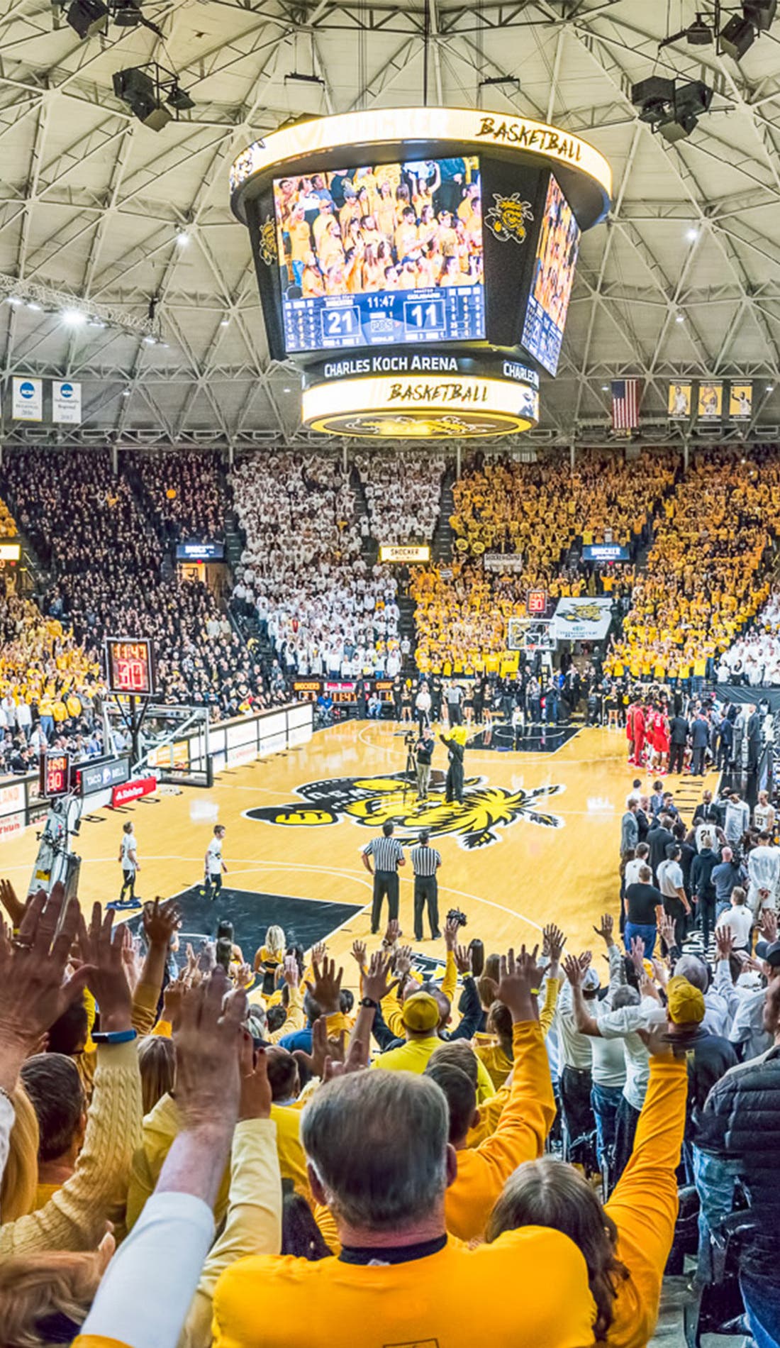 View from a seat at a Wichita State Shockers Mens Basketball vs Florida Gulf Coast Eagles Mens Basketball game, showing the teams playing