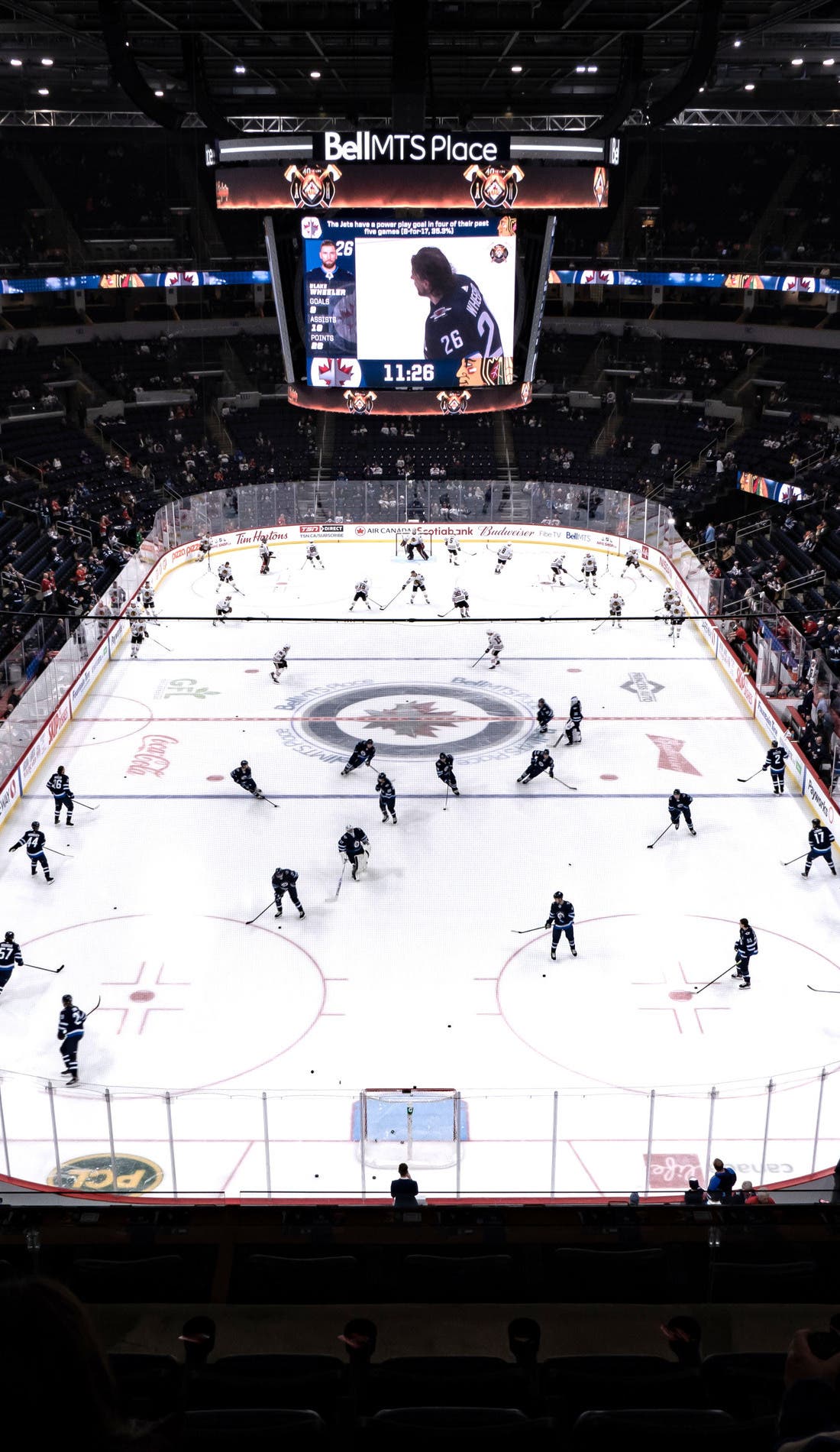 View from a seat at a Winnipeg Jets vs San Jose Sharks game, showing the teams playing
