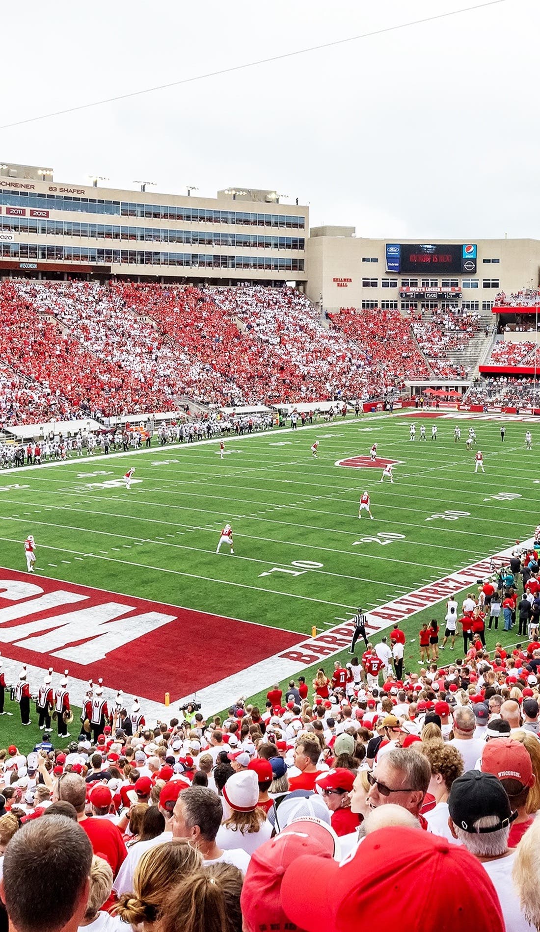 View from a seat at a Wisconsin Badgers Football vs Central Michigan Chippewas Football game, showing the teams playing
