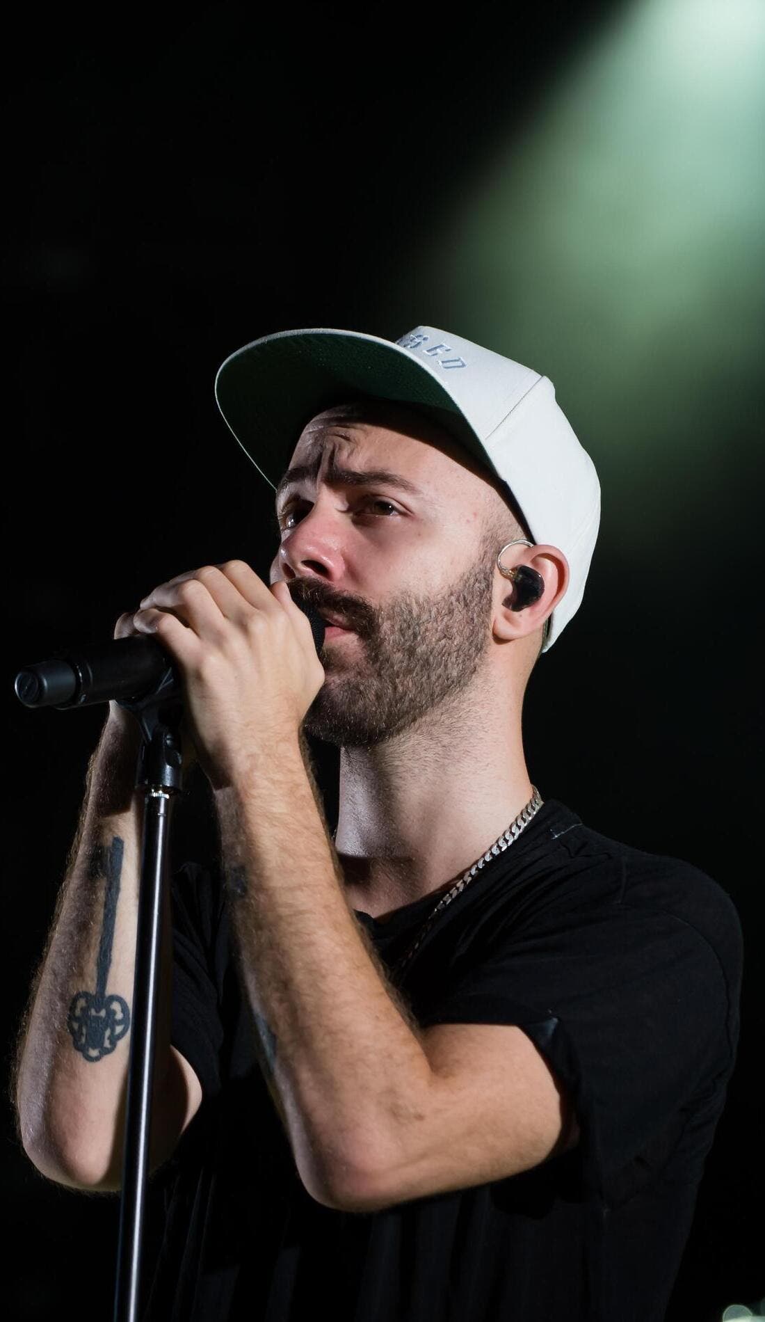 Woodkid promotional image for upcoming events and ticket sales