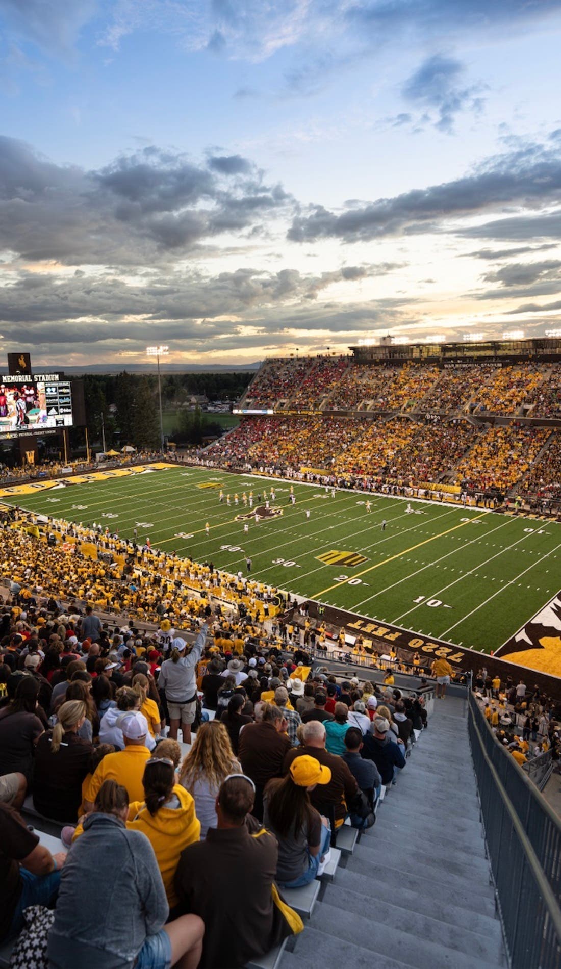 View from a seat at a Wyoming Cowboys Football vs Montana Grizzlies Football game, showing the teams playing