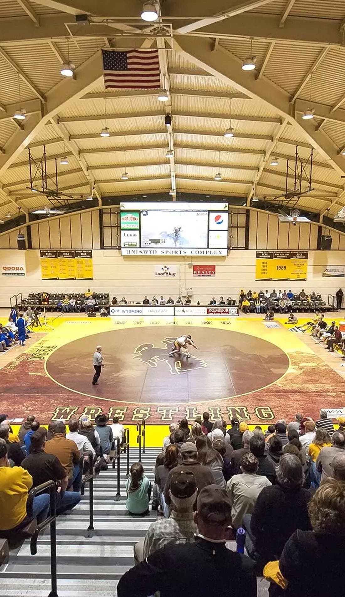 Wyoming Cowboys Wrestling promotional image for upcoming events and ticket sales