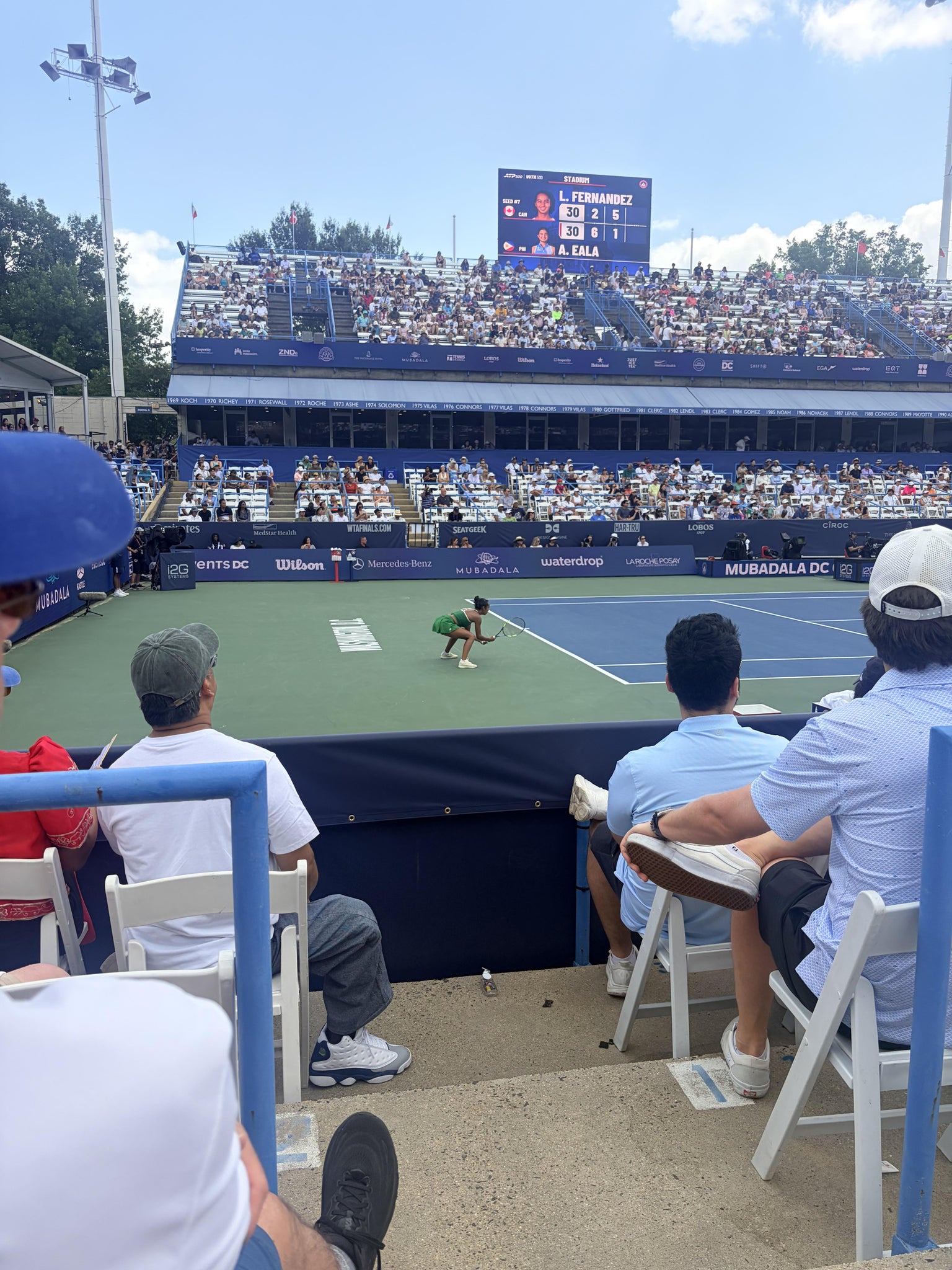 Real Fan View taken from Aisle 9 at Fitzgerald Tennis Stadium at Rock Creek Park Tennis Center by Laura B